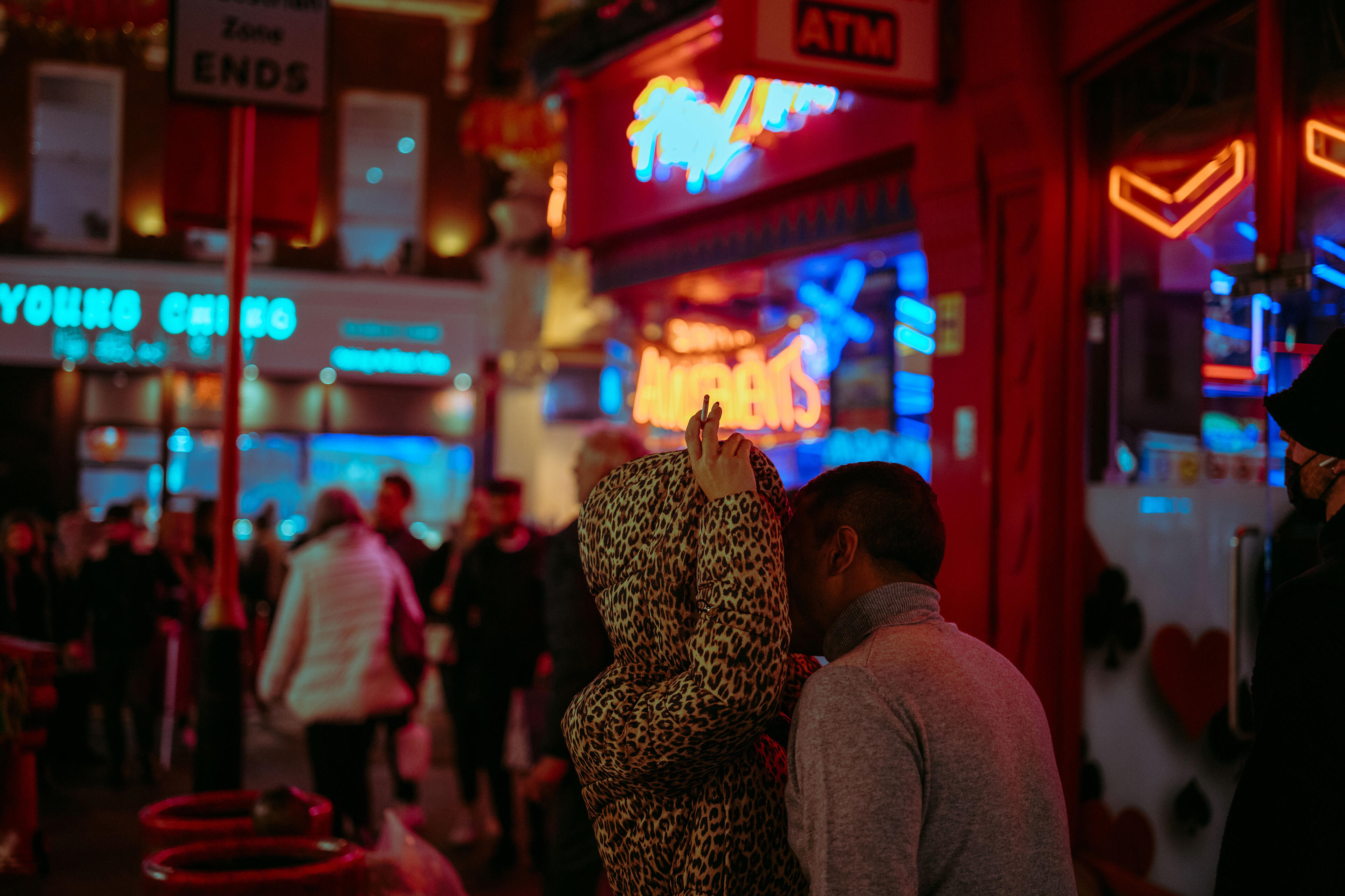 Man and woman kissing on the street
