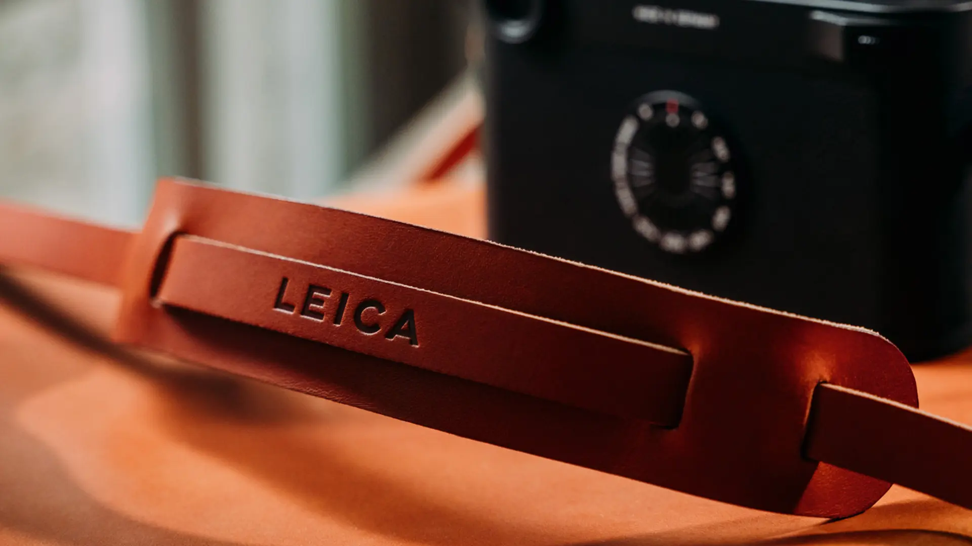 Leica camera with accessory strap