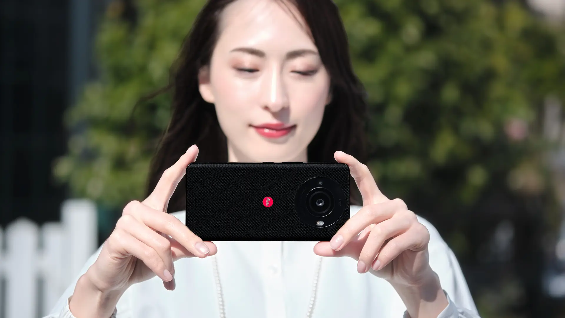 Woman with the leitz phone 3