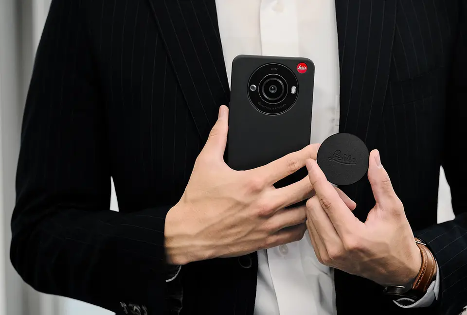 Man with a leitz phone 3