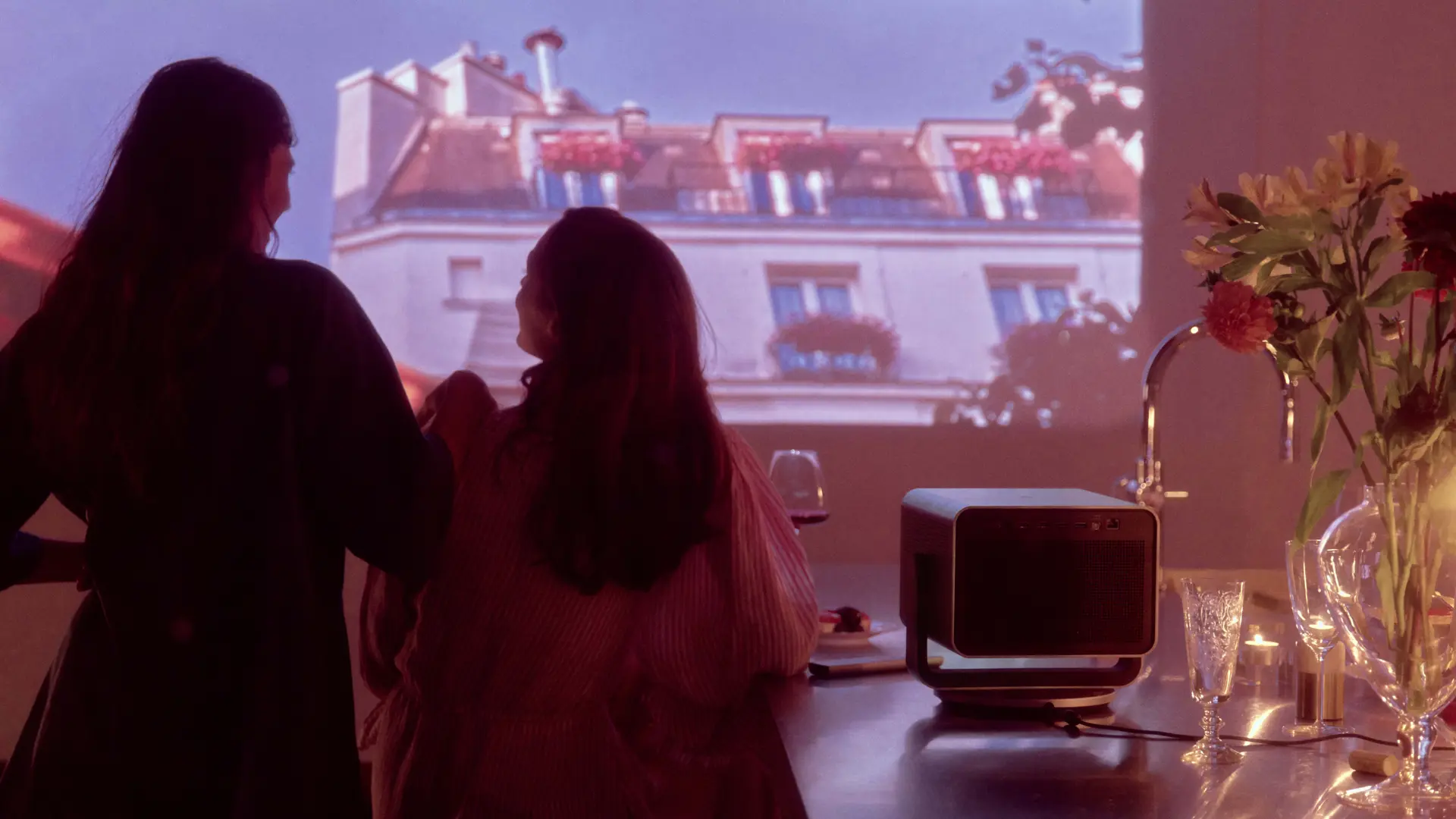 Two women watching a Leica Cine Play 1 projection.