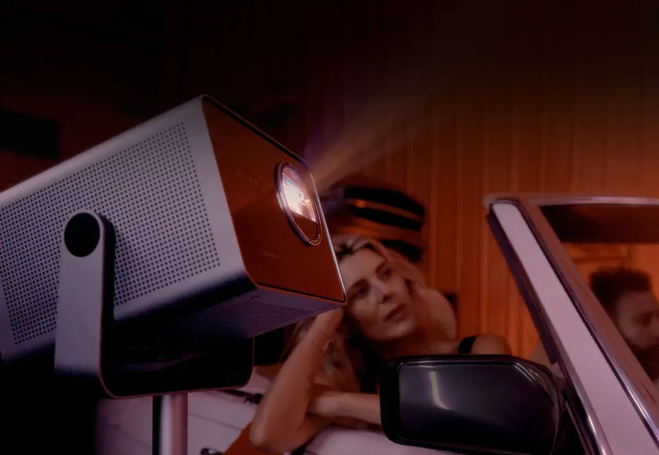 Woman watching a Leica Cine Play 1 projection in her car.