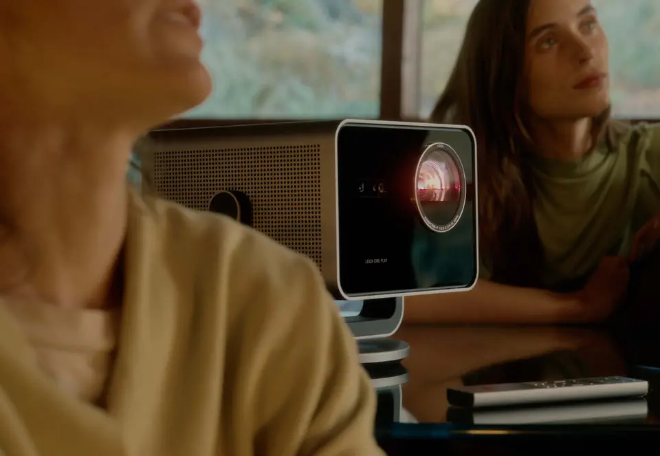 Two people watching a Leica Cine Play 1 projection.