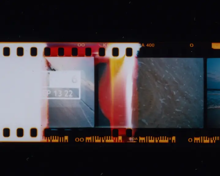 Photographed filmstrip with different images of water and a woman at the sea