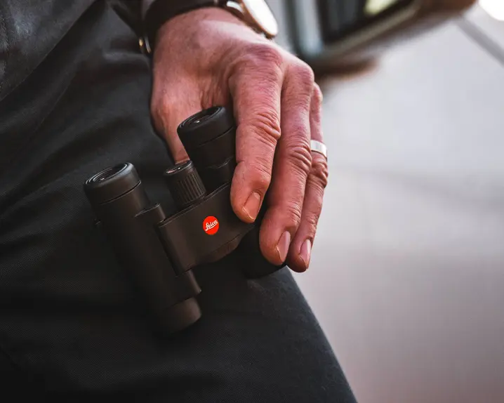 Leica-compact-binoculars-held-by-a-man