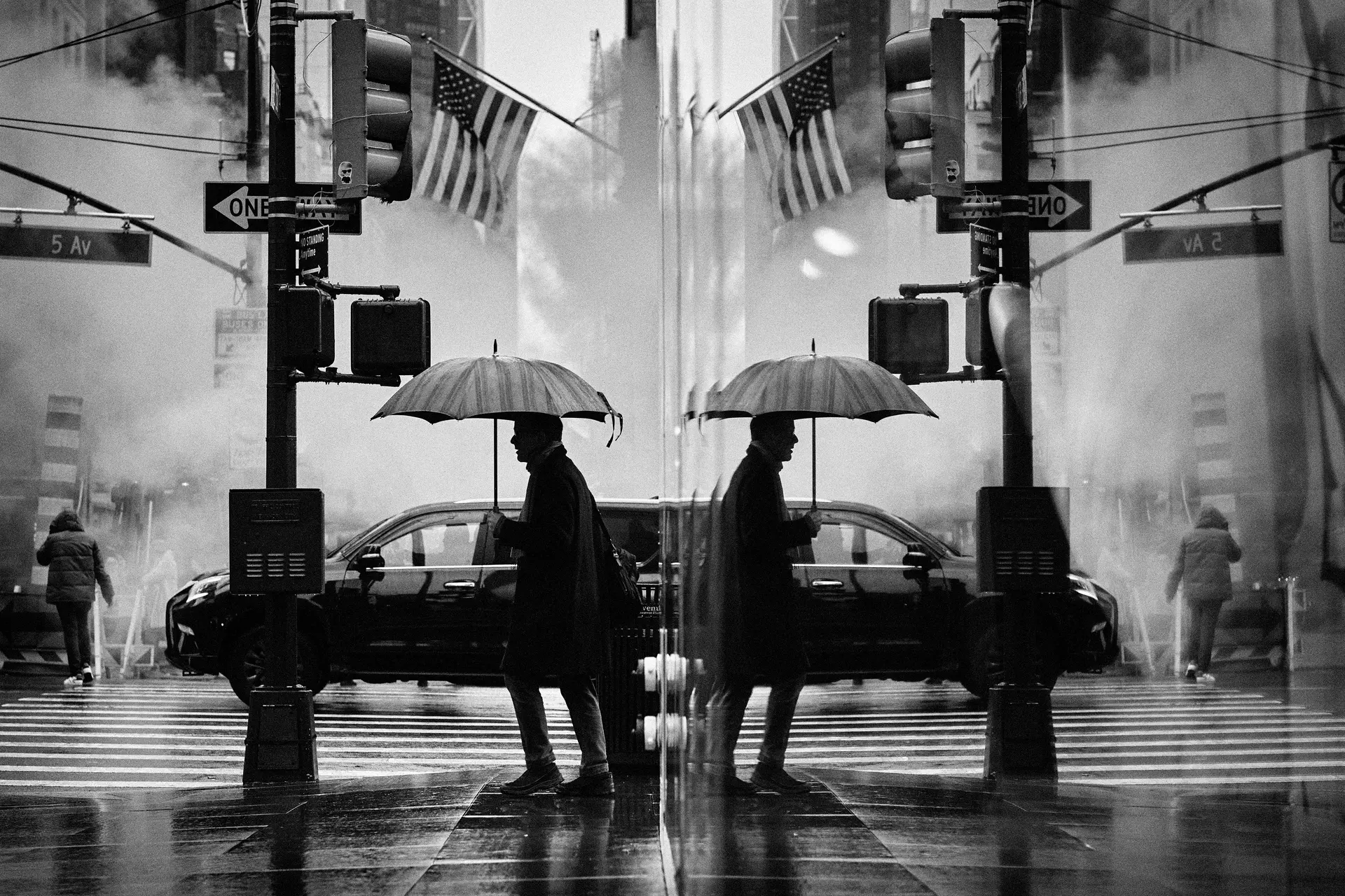 Man with umbrella reflected in the window