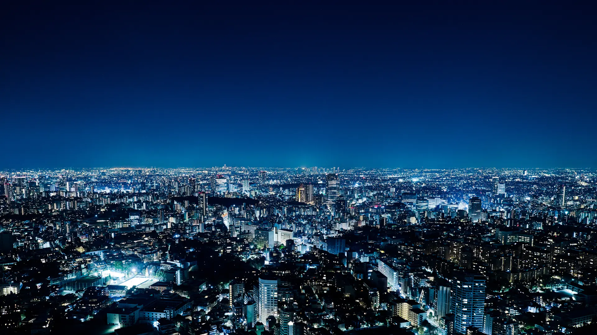 Panorama of an illuminated city at night.