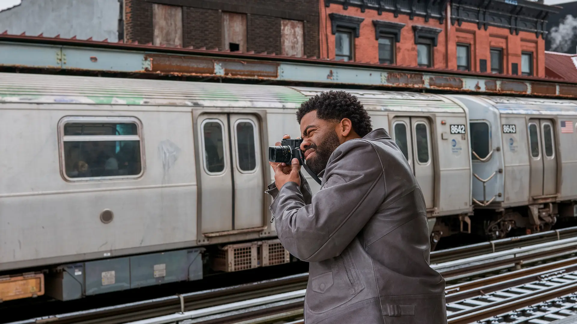 Photographer with a leica on a trainstation